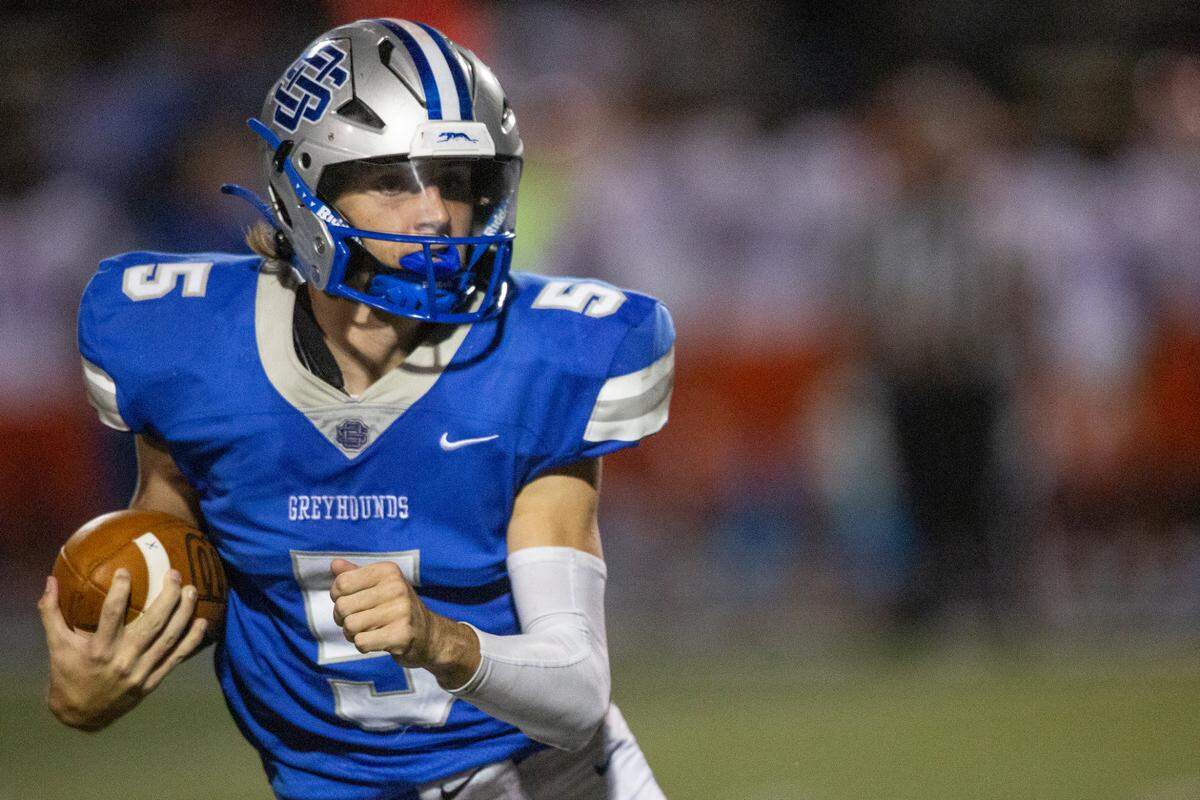 Ocean Springs’ quarterback Bray Hubbard carries the ball during a game at Greyhound Stadium in Ocean Springs on Friday, Oct. 28, 2022.