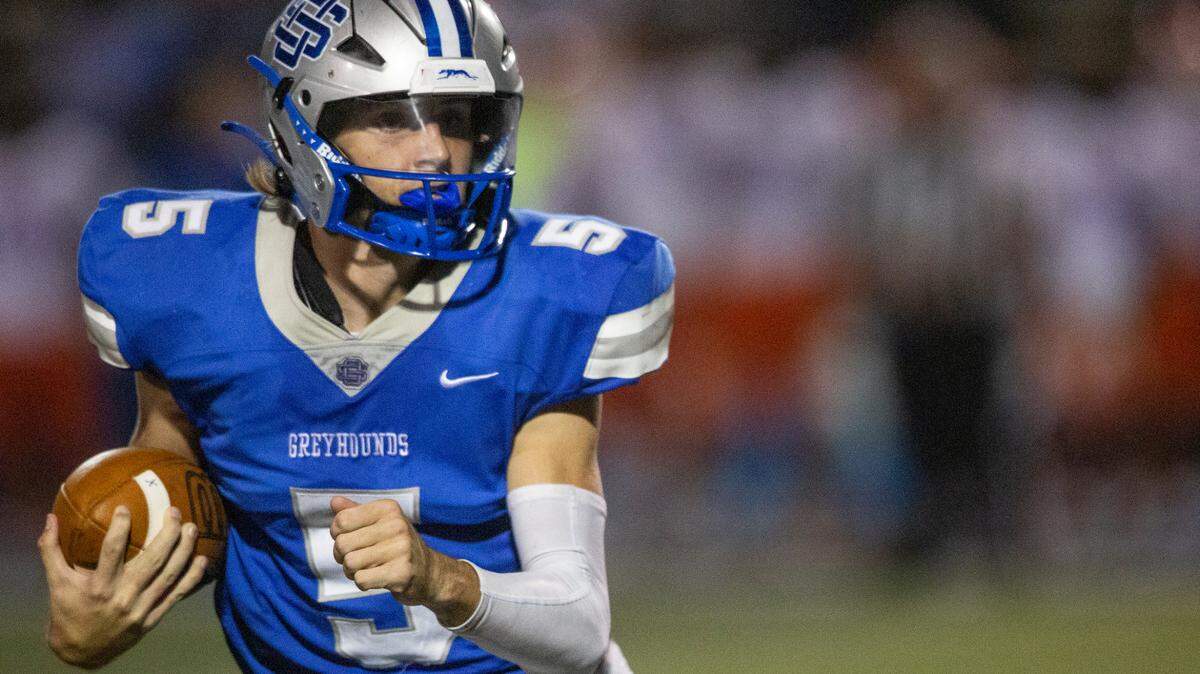 Ocean Springs’ quarterback Bray Hubbard carries the ball during a game at Greyhound Stadium in Ocean Springs on Friday, Oct. 28, 2022.