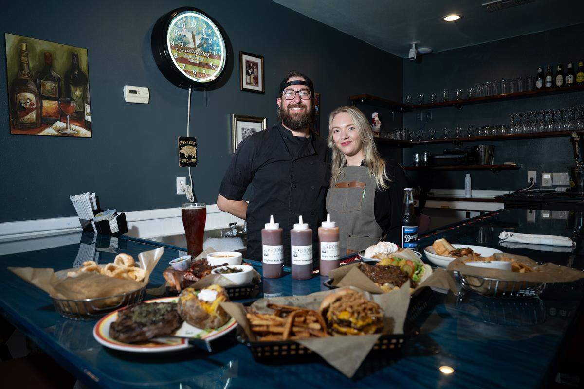 Roderick Herring Jr. and Mikayla Herring put out a spread of their signature dishes at Boonies on the Bayou in Bay St. Louis on Friday, Dec. 5, 2025.