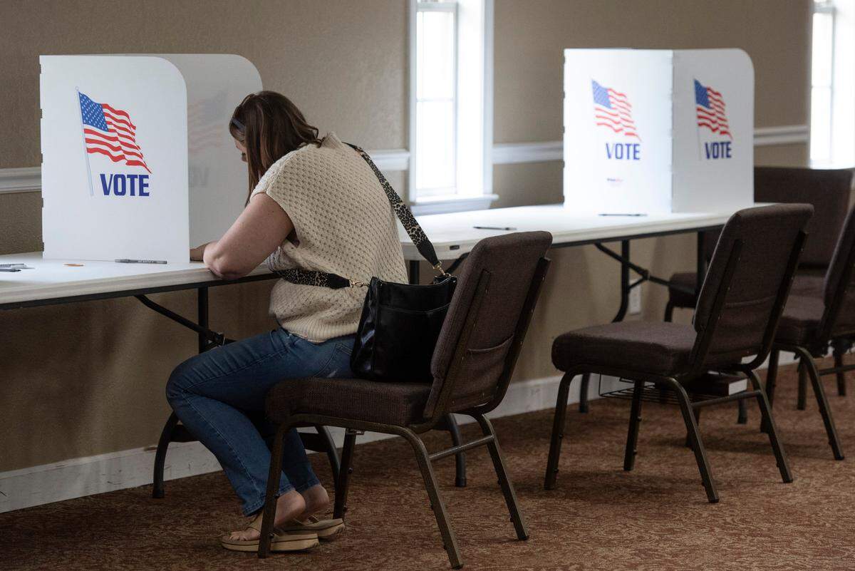 A voter casts a ballot at Grace Baptist Church in Ocean Springs during the municipal primary election on Tuesday, April 1, 2025.