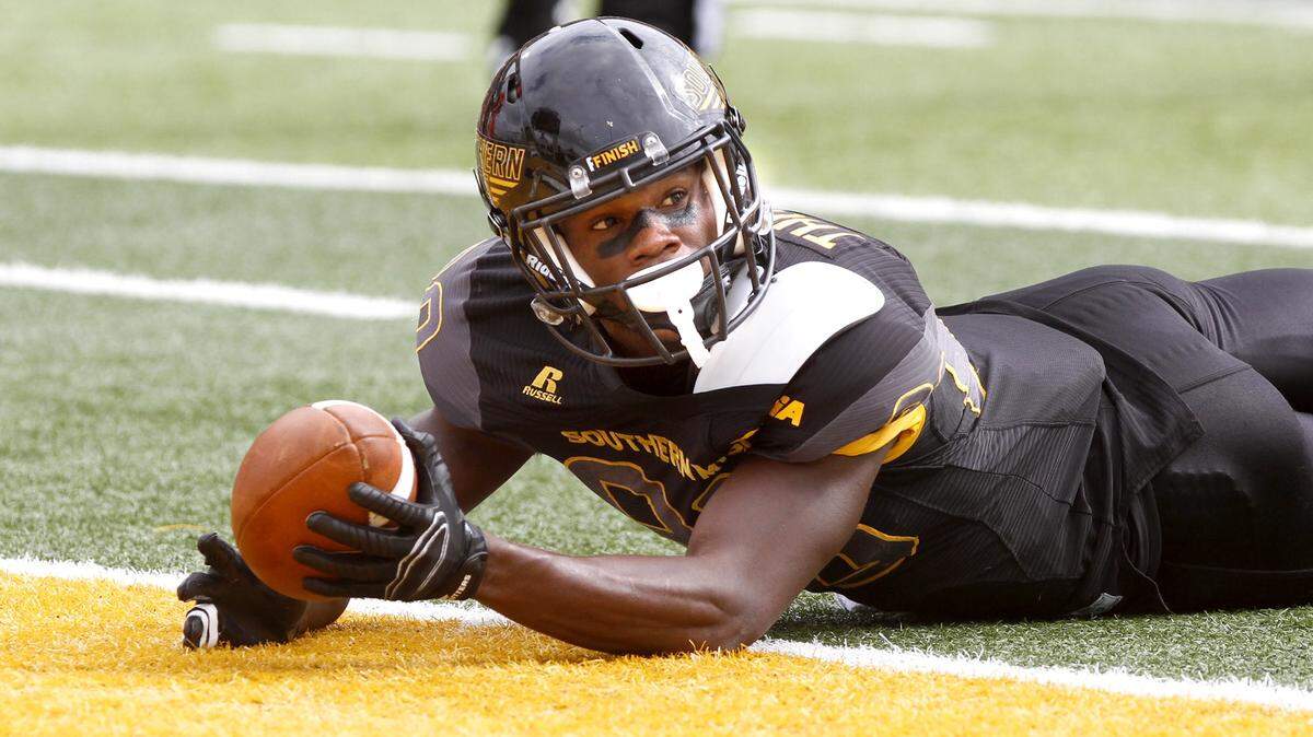 TIM ISBELL/SUN HERALD 
 Southern Miss receiver Mike Thomas looks for the referee's touchdown call after diving into the end zone against UTEP, Saturday, Oct. 31, 2015.