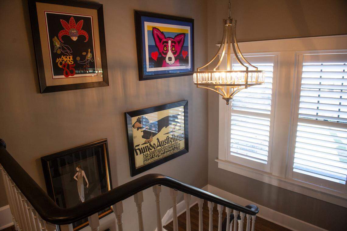 Artwork from New Orleans’ artists lines the walls in the Glenn Swetman House in Biloxi on Monday, Dec. 11, 2023, after the Lombardi-Bensons renovated the home.