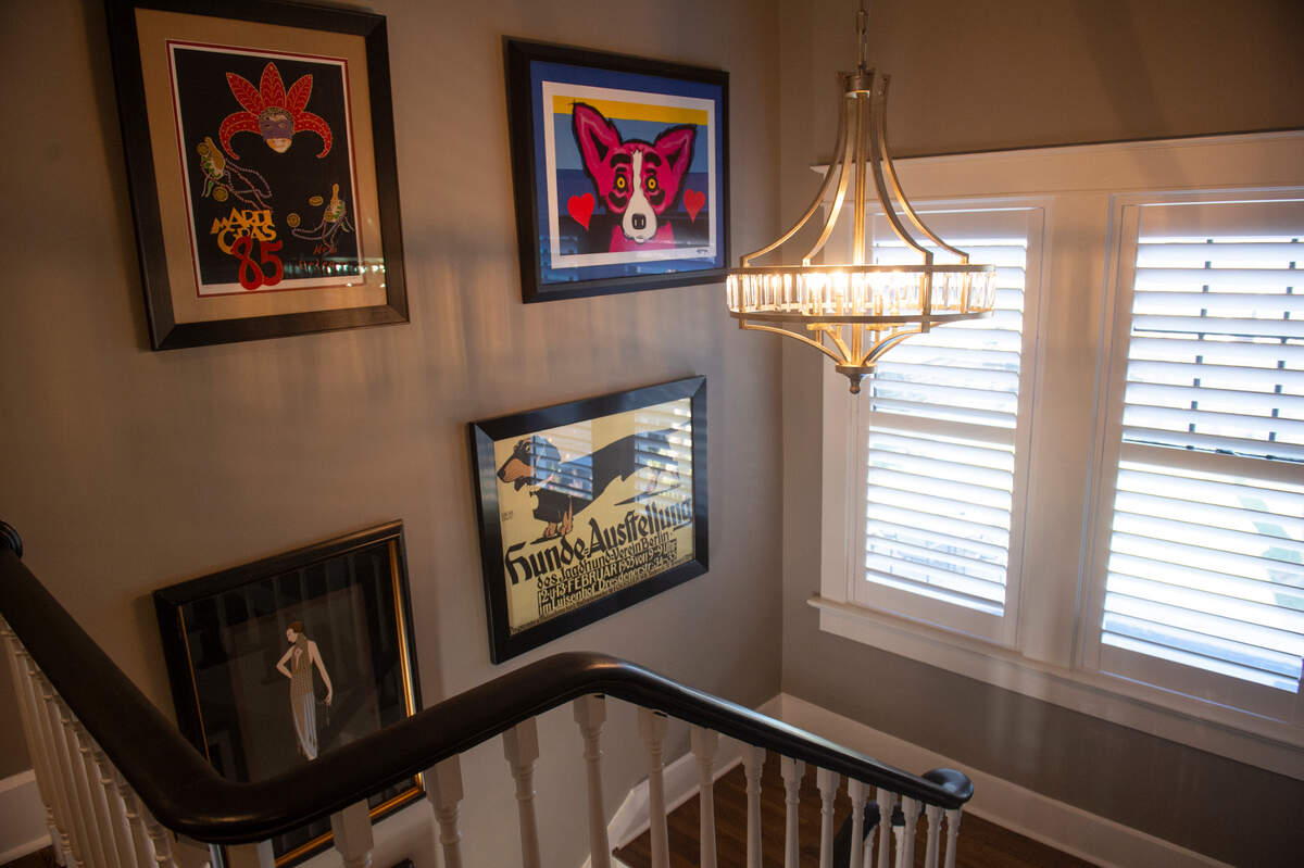 Artwork from New Orleans’ artists lines the walls in the Glenn Swetman House in Biloxi on Monday, Dec. 11, 2023, after the Lombardi-Bensons renovated the home.