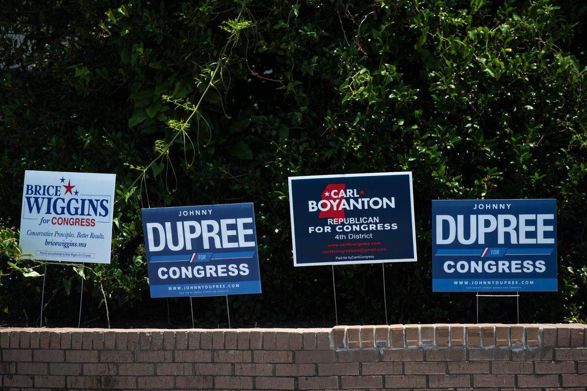 Signs for different Congressional candidates sit outside the D’Iberville Civic Center on Tuesday, June 7, 2022.