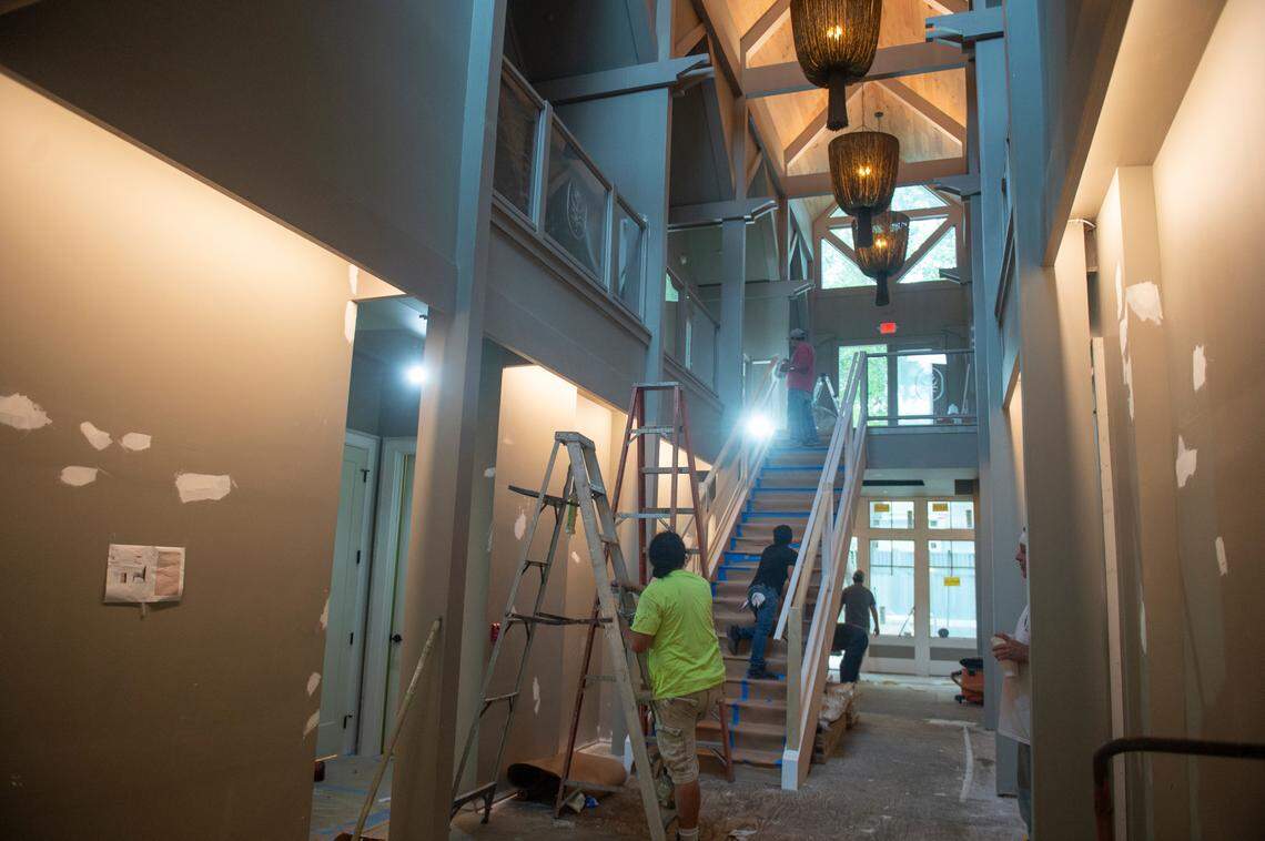 Crews work on the main stairwell of The Springs Hotel while it’s under construction in the downtown.