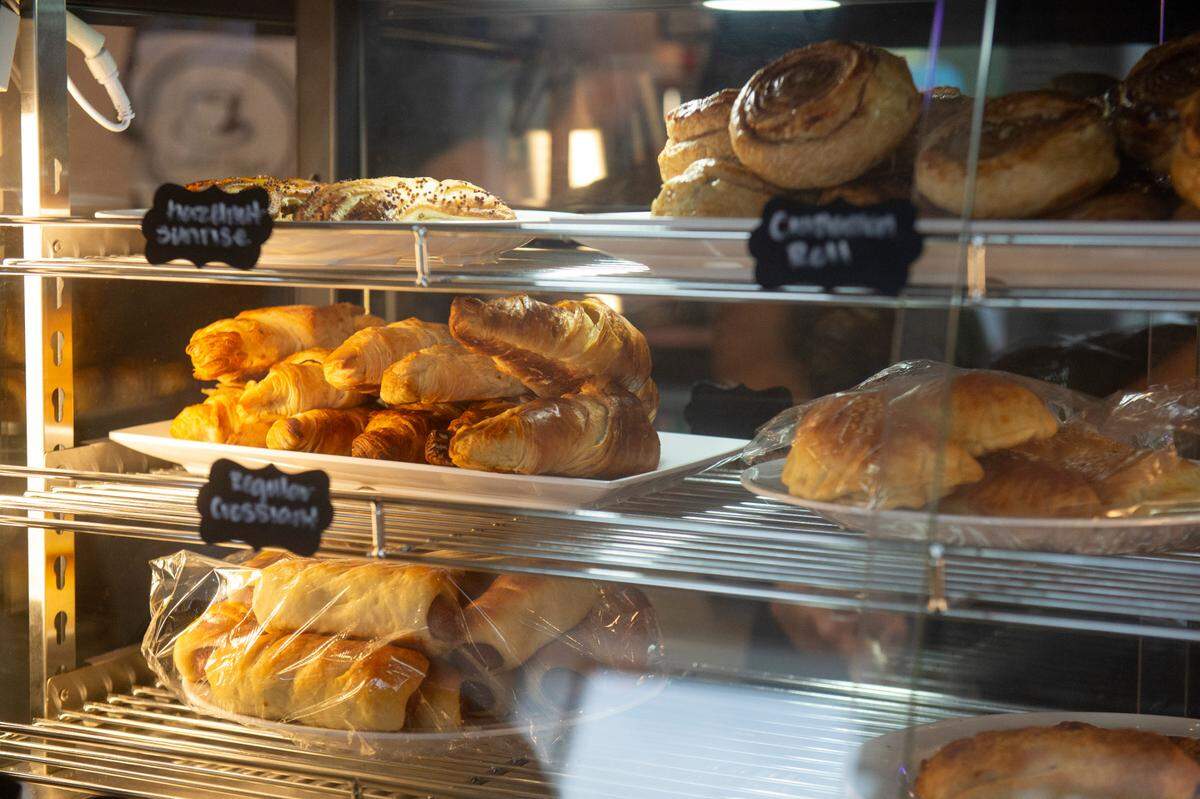 Pastries, including croissants, fill the case at the new Zaki’s Cafe in Gulfport.