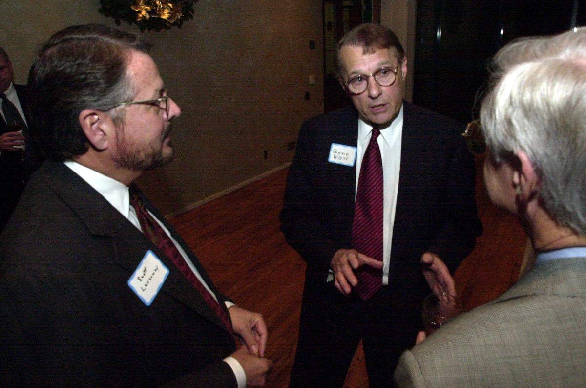 Gene Warr of Gulfport, center, talks with fellow Coast 21 members Scott Levanway, left, and Dr. Jim Williams prior to the South Mississippi Partnership 2001 meeting held at Lake Terrace Convention Center in Hattiesburg.