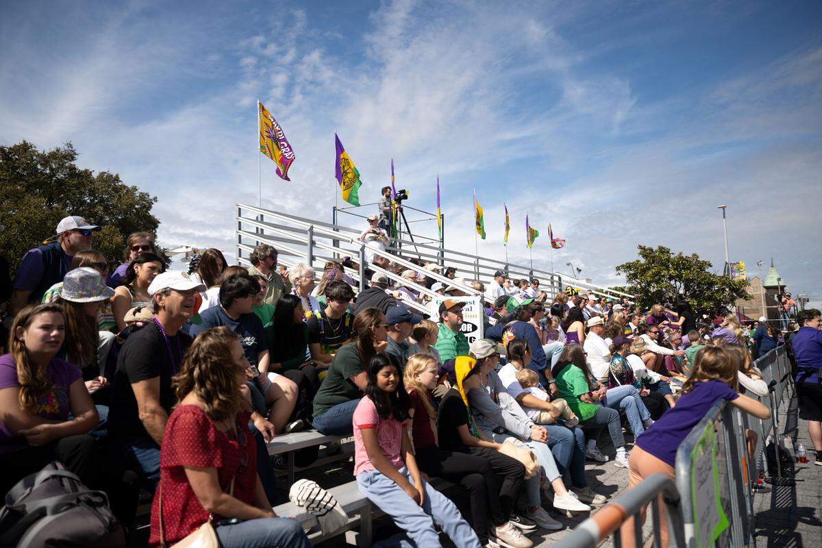 Crowds of people gather outside City Hall during the Gulf Coast Carnival Association’s Fat Tuesday parade in Biloxi on Tuesday, Feb. 17, 2026.