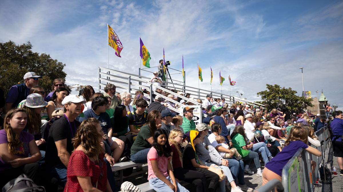 Crowds of people gather outside City Hall during the Gulf Coast Carnival Association’s Fat Tuesday parade in Biloxi on Tuesday, Feb. 17, 2026.