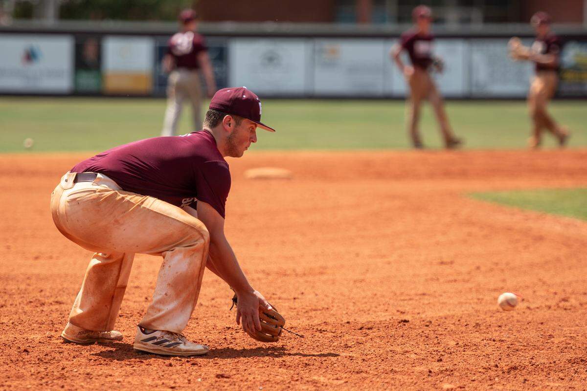 East Central infielder Nate Trochessett catches a ground ball during practice at East Central High School in Hurley on Tuesday, April 30, 2024.