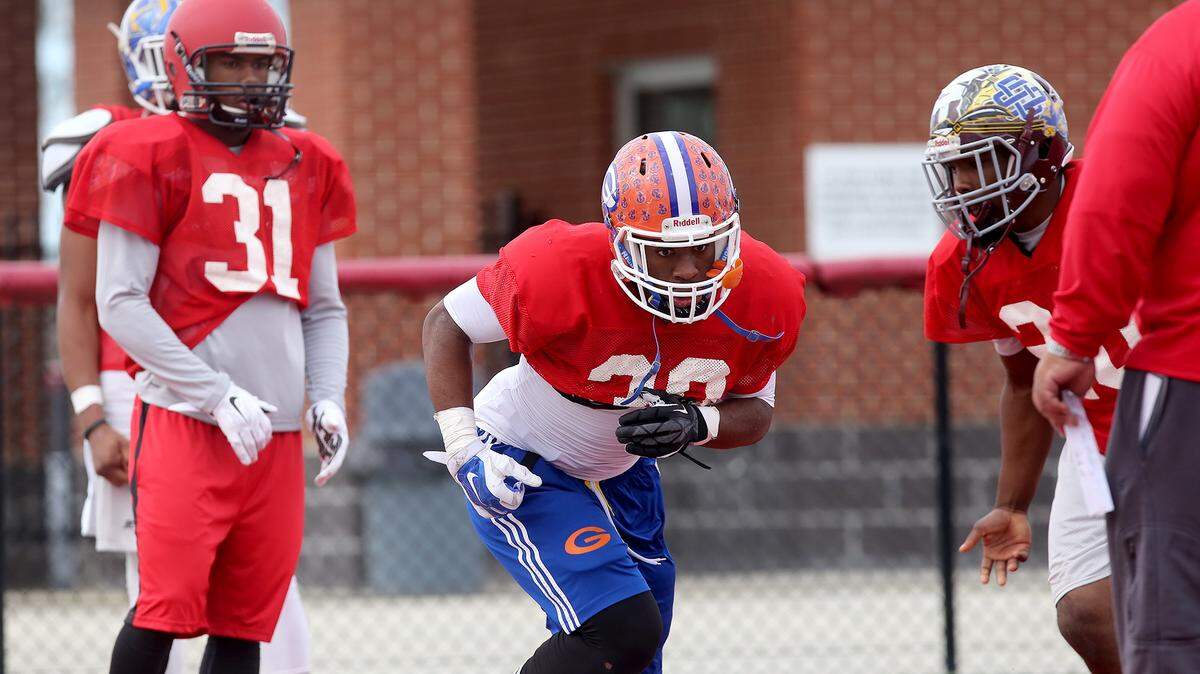 AMANDA McCOY/SUN HERALD 
 Gulfport running back Deon Cole, center, runs a play while practicing for the Bernard Blackwell All-Star Classic on Thursday, December 17, 2015. The game will be held on Saturday at Milner Stadium in Gulfport.