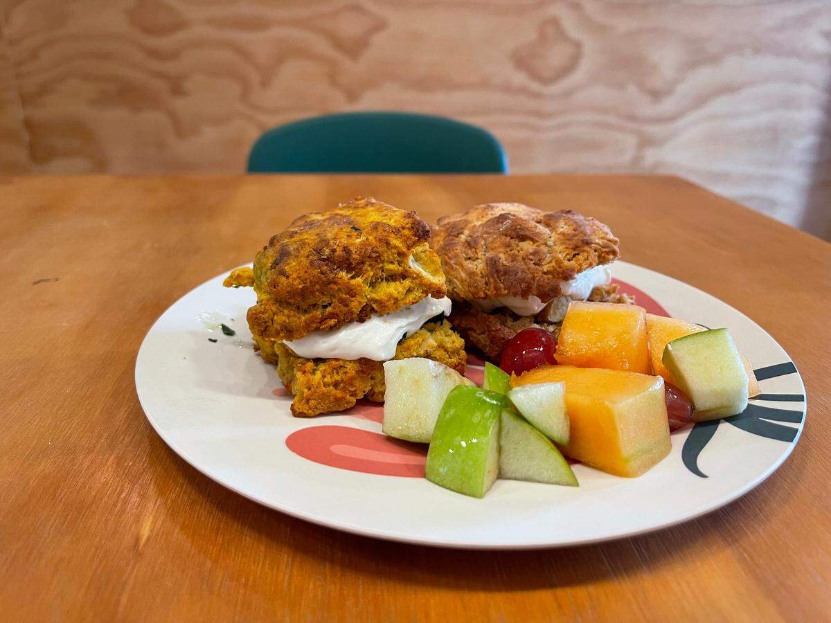 The biscuit plate at Greenhouse Biloxi includes the restaurant’s sweet and savory biscuit of the day and fresh fruit.