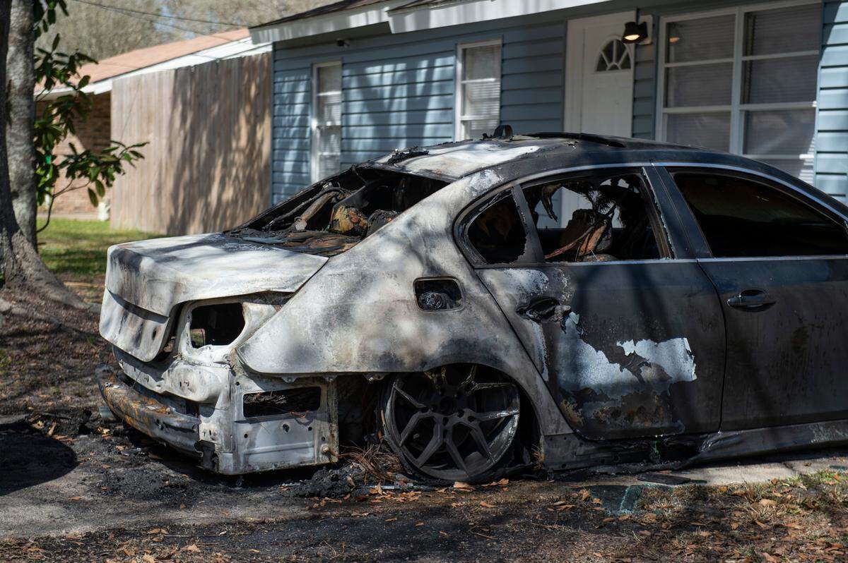 A BMW belonging to Gustavo Santos Jr. parked outside a home on Hester Street in Pascagoula on Monday, March 21, 2022. According to Gustavo Santos Sr., someone set the car on fire on Sunday.