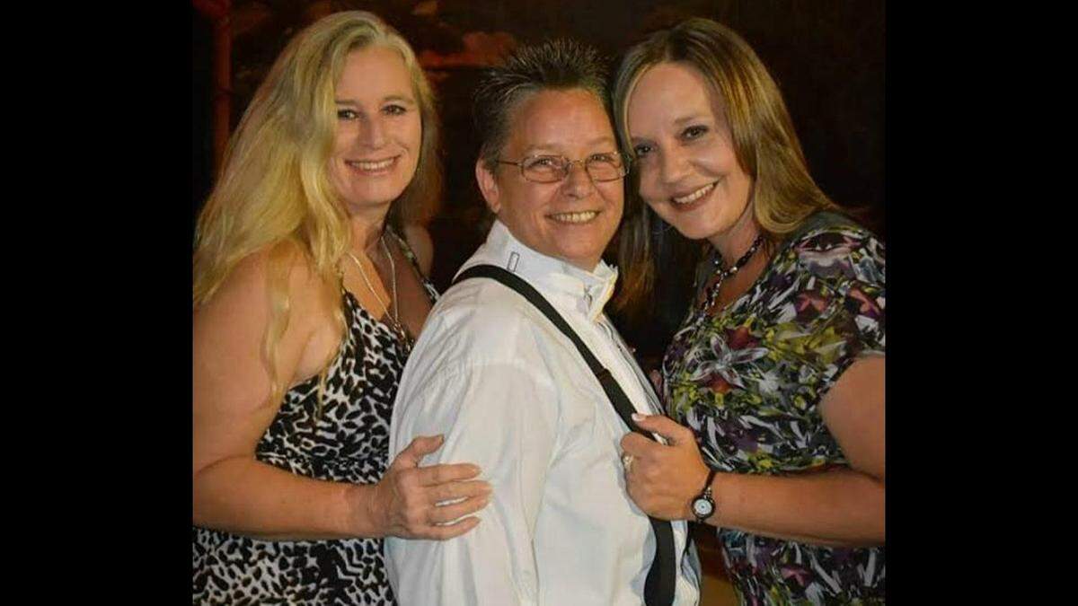 Lynn Koval, center, is fighting stage four laryngeal cancer. She has owned a gay bar in Biloxi for over 20 years. She is pictured here with her sister, Lysa Broussard, left, and Koval’s wife, Tamara Koval.