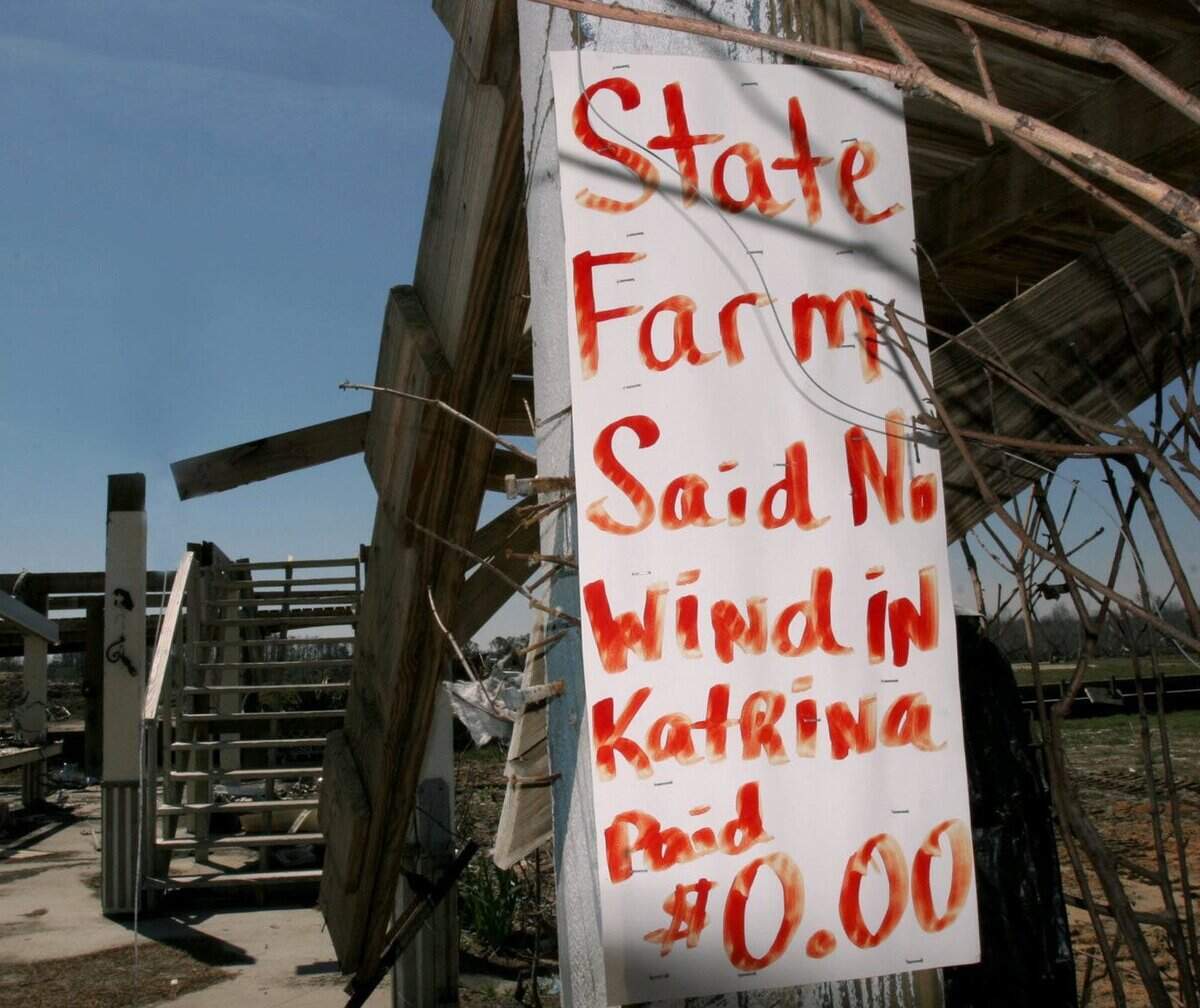 A sign at a Waveland home illustrates the frustration homeowners are feeling towards their insurance companies after Hurricane Katrina. Hundreds sued after insurers denied their claims for wind damage from the Category 3 hurricane. The companies said surge covered by federal flood insurance caused the destruction.