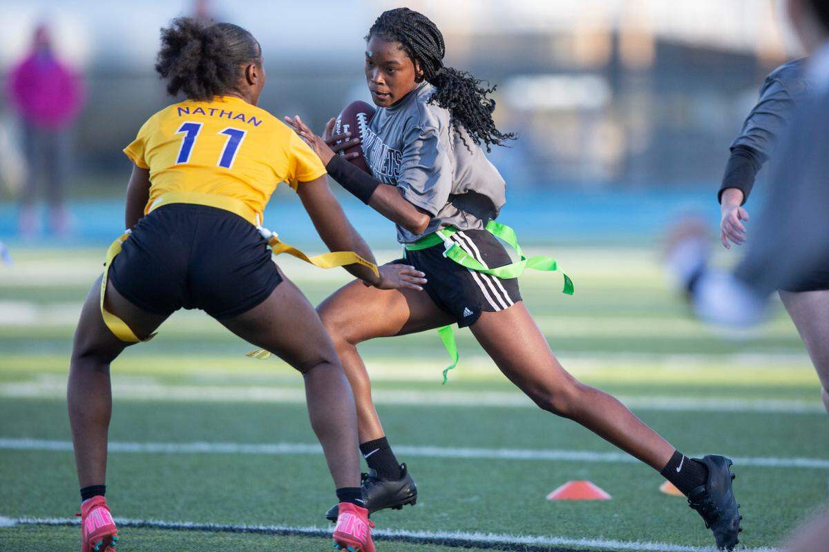 East Central’s Taliyah Nichols runs the ball past St. Martin’s Yvette Nathan during a Jamboree game at Vancleave on Thursday, March 20, 2025.