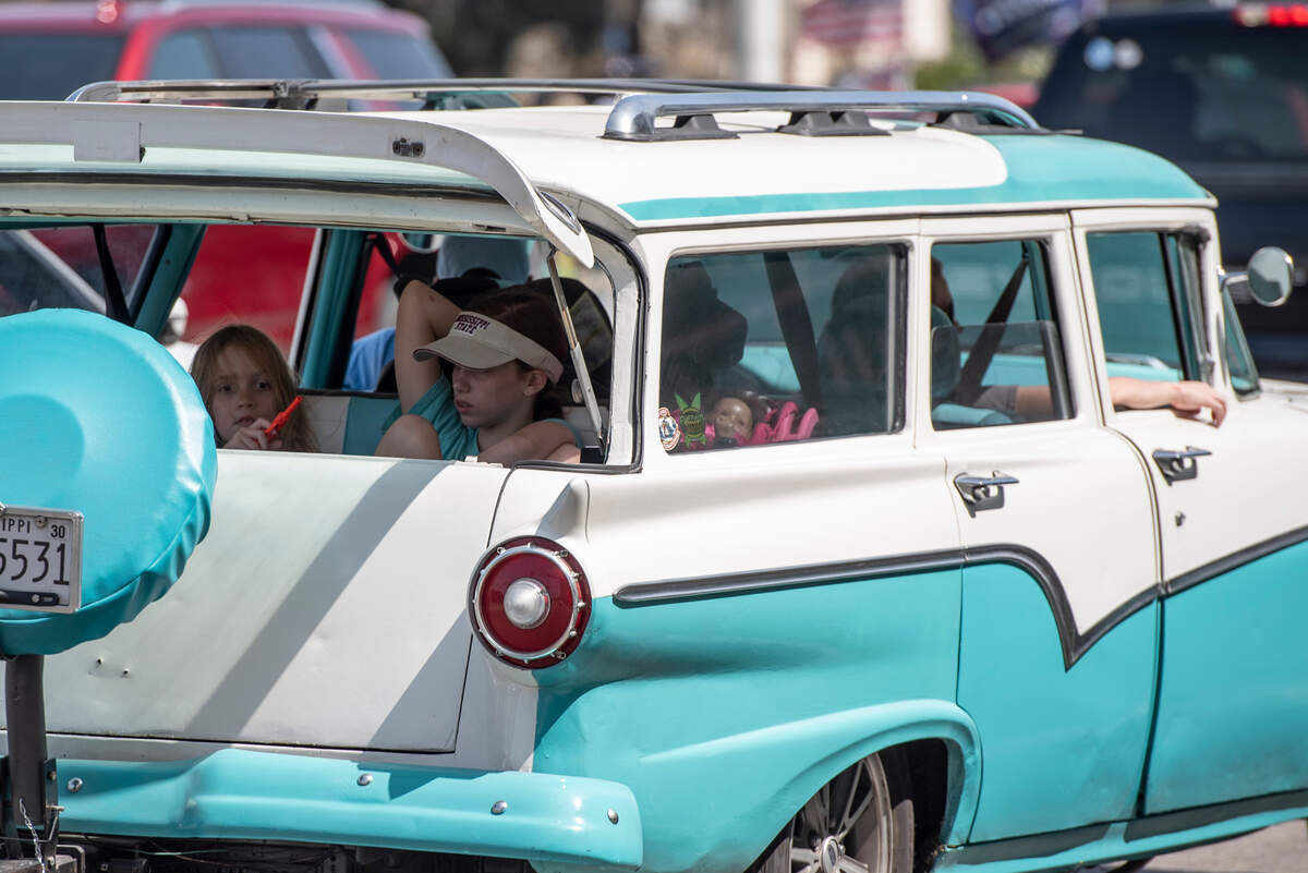 A classic car drives along Highway 90 in Biloxi during Cruisin’ the Coast on Wednesday, Oct. 4, 2023.