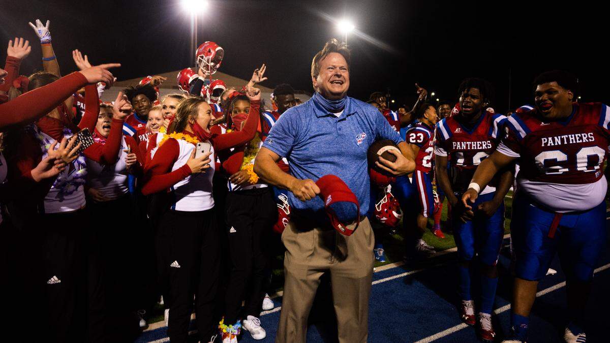 Pascagoula Head Coach Lewis Sims celebrates with the cheerleaders and his team in front of the home stands following the Panthers’ 35-32 overtime victory over Hattiesburg on Friday, Nov. 20, 2020.