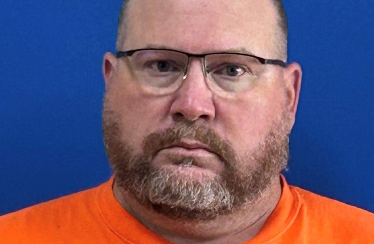 George County athletic director Chris West, 51, faces one count of possession of child pornography and one count of distribution of child pornography.