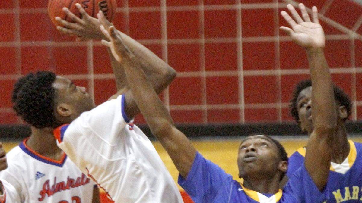 TIM ISBELL/SUN HERALD 
 Gulfport's Keevon Oney puts up a jumper in the lane over St. Martin's Jalen Lett, Monday, Jan. 18, 2016.
