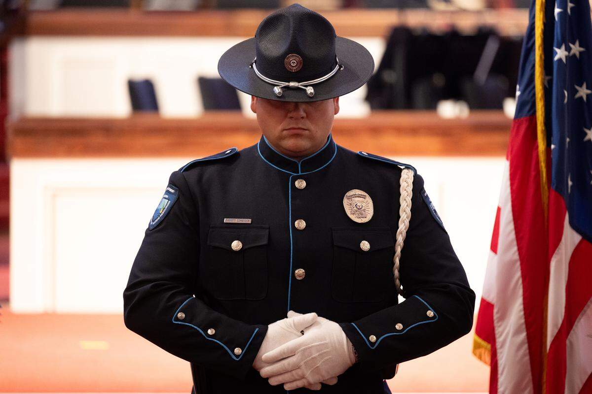 Garrett Comstock stands on casket guard Friday during the funeral for Michael Jimerson at First Baptist Church in Biloxi.