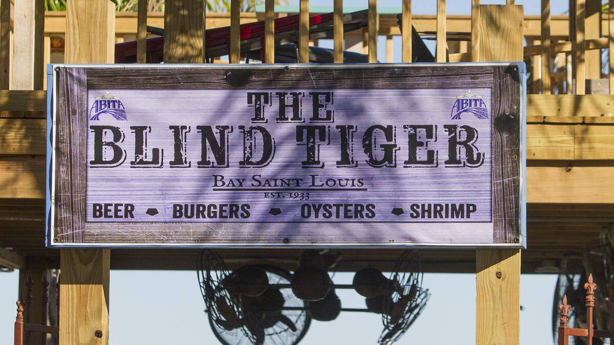 AMANDA McCOY/SUN HERALDPatrons enjoy food and drinks on The Blind Tiger patio overlooking the Bay of St. Louis in Bay St. Louis. A permit has been issued for The Blind Tiger in Gulfport, planned for a spring opening on U.S. 90.
