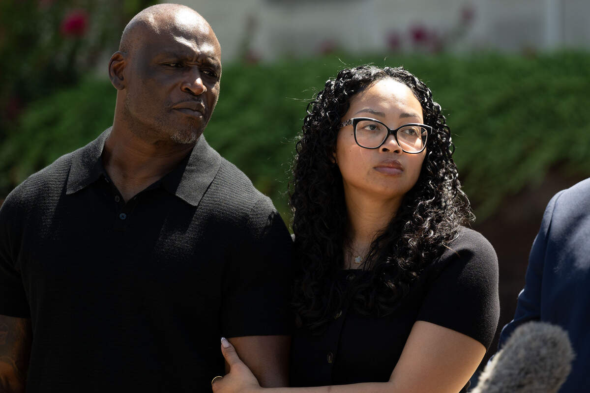 Elmore Wonsley, left, and Christine Wonsley listen as questions are asked Wednesday during a news conference outside the Jackson County Courthouse.