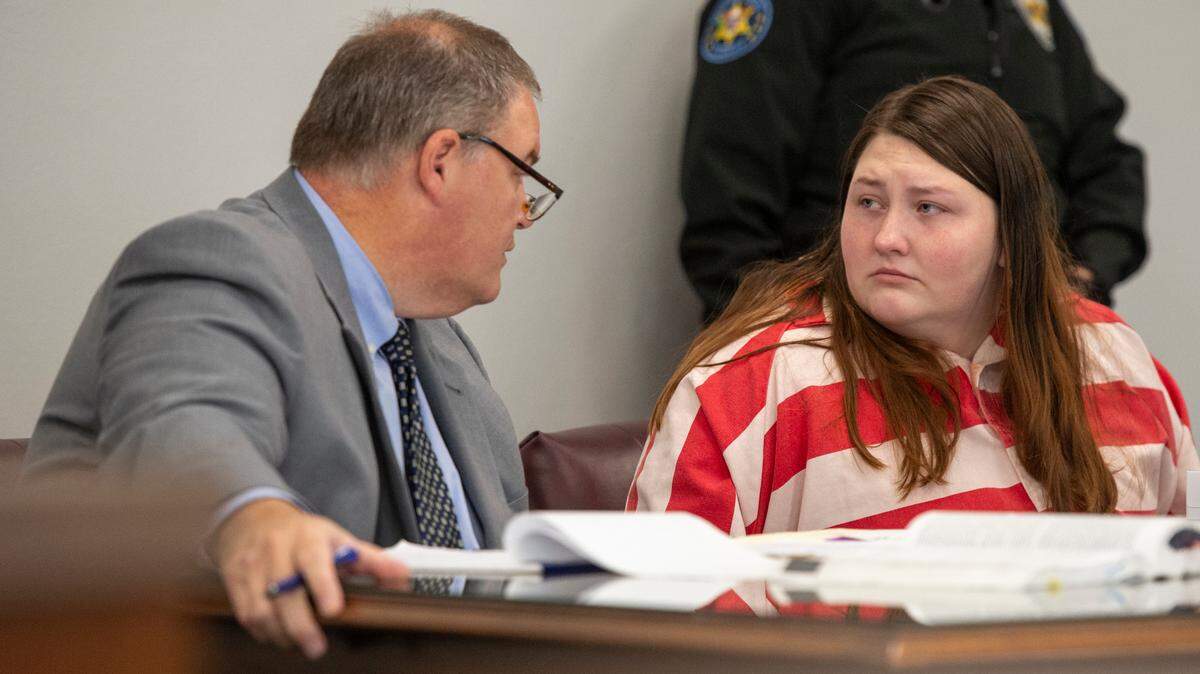 Summer Rose Hill, accused of capital murder in her 6-month-old daughter’s death, sits with her attorney Scott Lusk during a probable cause hearing at County Court in Biloxi on Thursday, Oct. 17, 2024.
