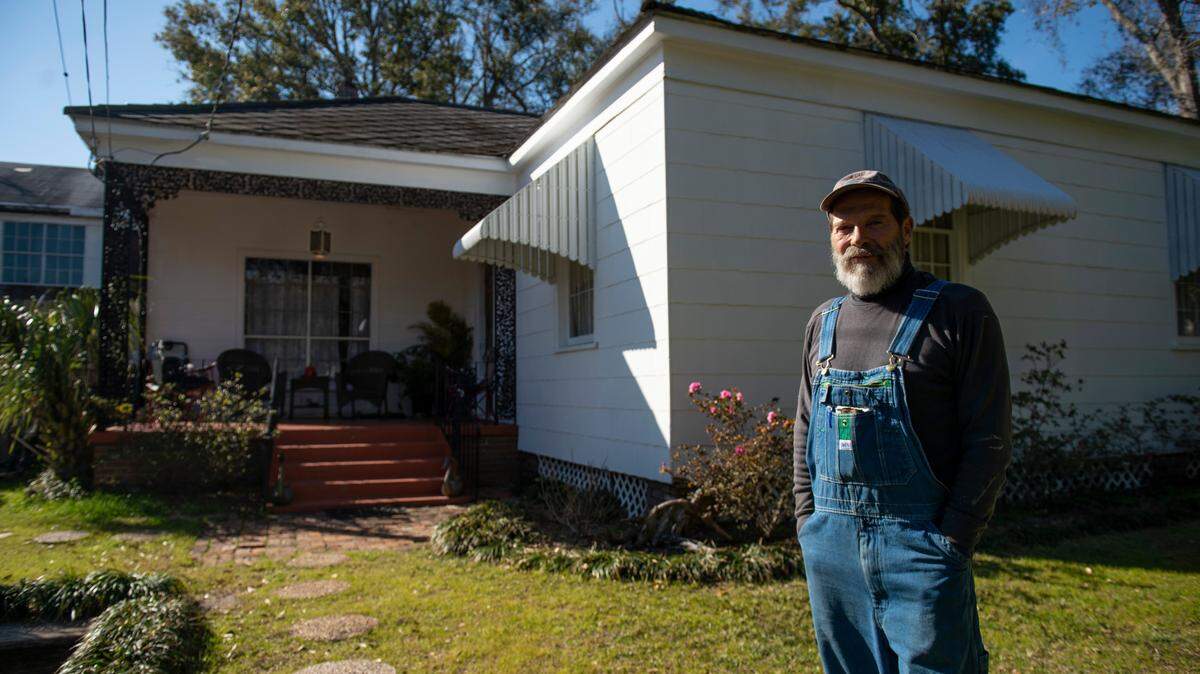 Phillip Lentz Grant outside his home in Biloxi on Thursday, Feb. 10, 2022. Grant’s home, which originally belonged to his mother who bought it in 1962, had to be re-leveled after construction work in front of his home caused it to sink.