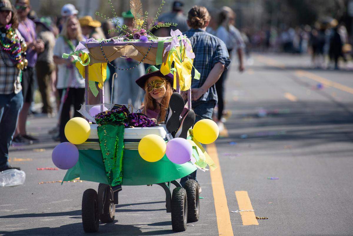 Revelers during the Jackson County Carnival Association Mardi Gras parade in Pascagoula on Saturday, March 1, 2025.