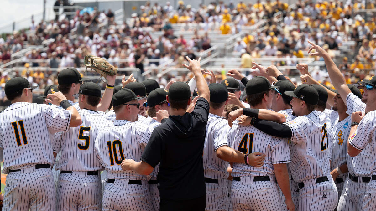 Southern Miss players huddle before an NCAA Regional game in Hattiesburg on Friday, May 29, 2026.