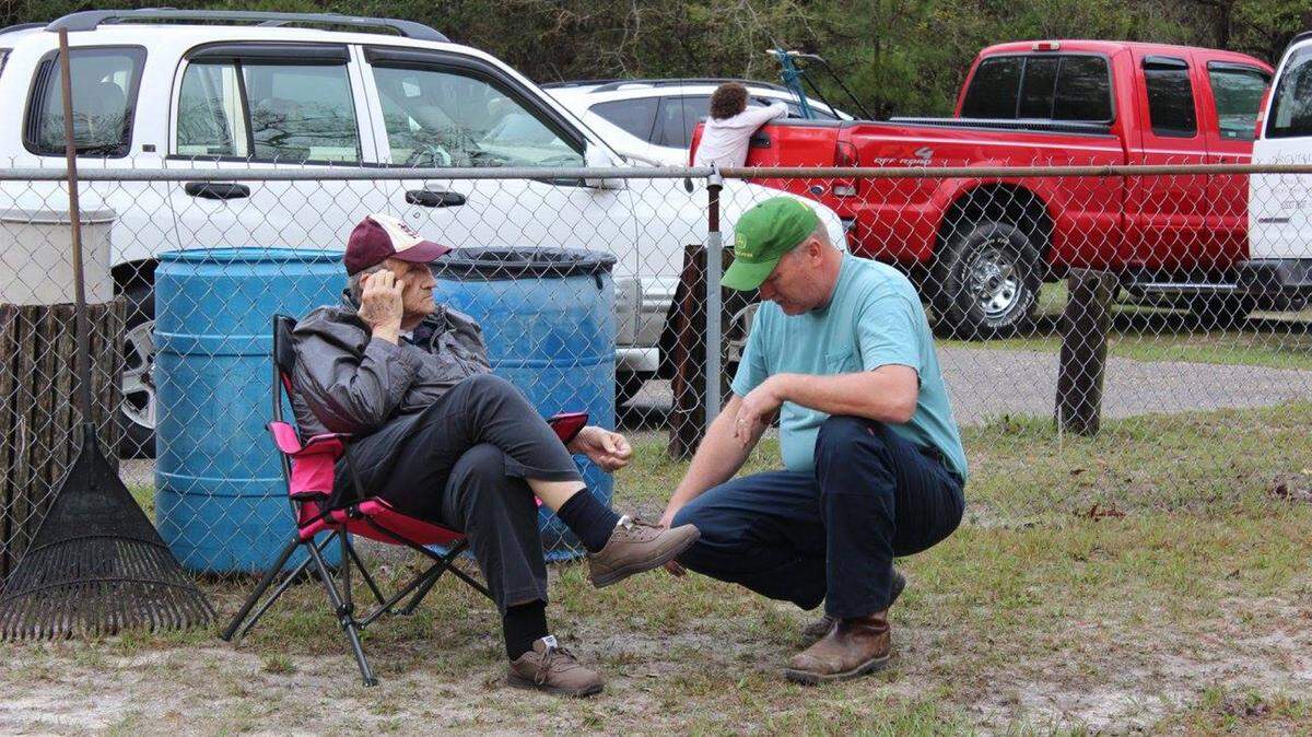 COURTESY MALINDA BEAUGEZ 
 Cemetery commitee President Charlie Seymour talks to Raymond 'Big Boy' Beaugez, great-grandson of William Seymour.