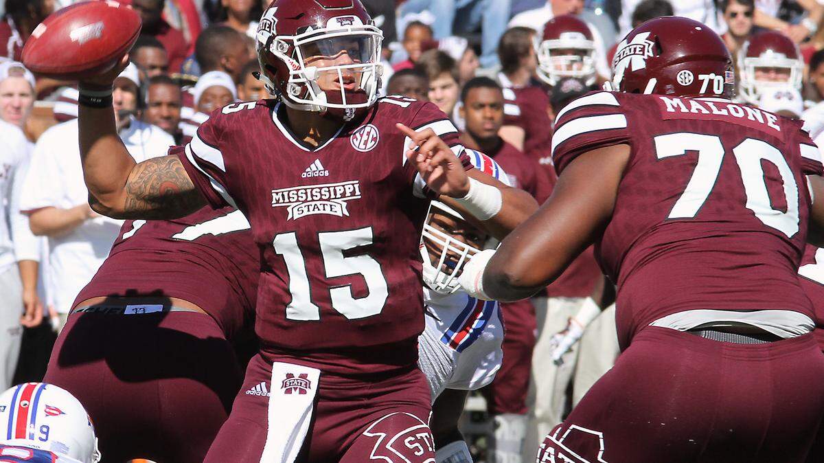 JIM LYTLE/ASSOCIATED PRESSMississippi State quarterback Dak Prescott (15) receives blocking from teammate Justin Malone (70) against Louisiana Tech.