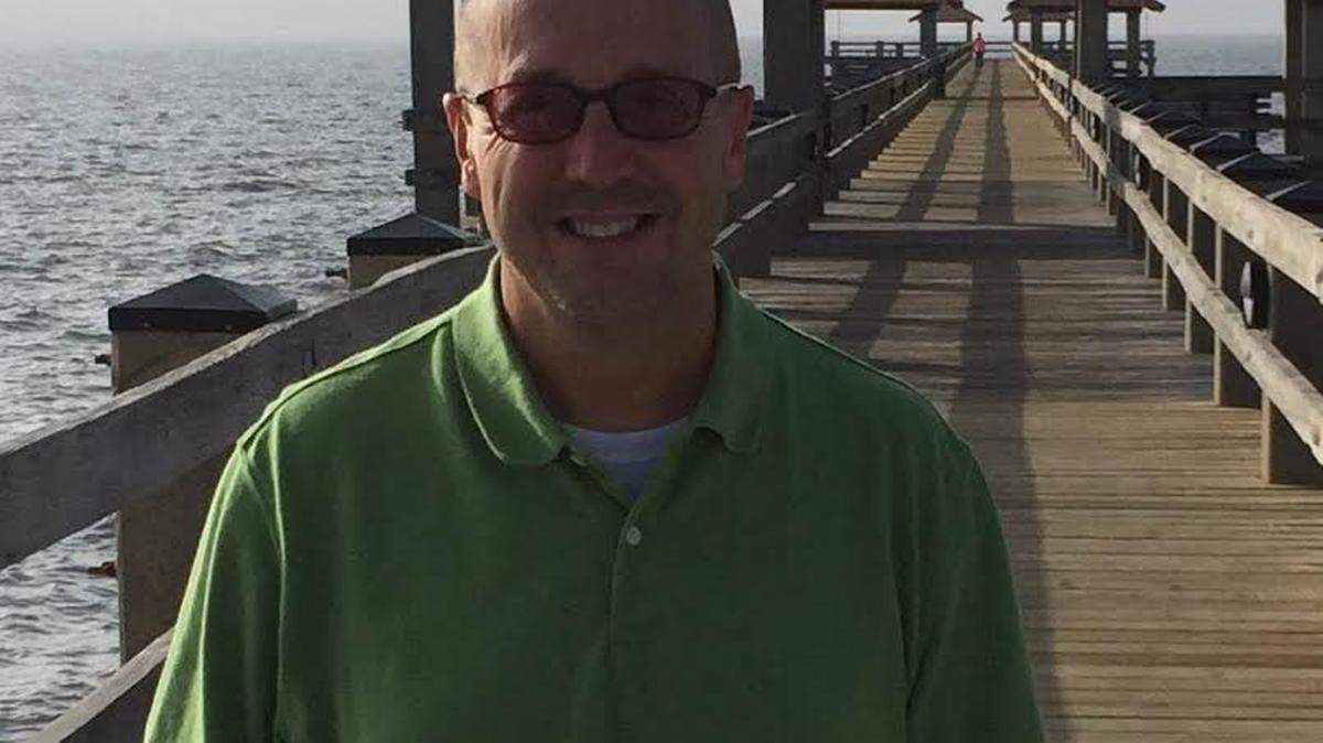JEFF CLARK/SPECIAL TO THE SUN HERALDKen Combs Jr. stands in front of his father's namesake, the Ken Combs Pier, which will host the first Veterans Day Pier Walk on Wednesday at 4 p.m. The walk will benefit the Gulf Coast Public Safety Feed the Needy food pantry.