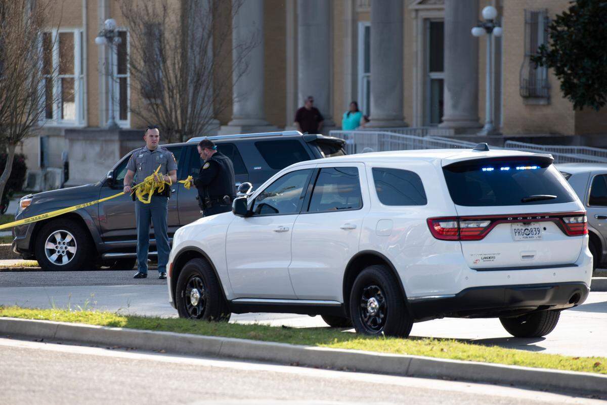Law enforcement clear the scene of a shooting outside the Pearl River County Courthouse Annex in Poplarville on Tuesday, Dec. 17, 2024.