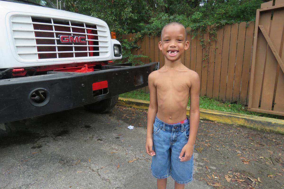 Samantha Dees’ 7-year-old son poses for a photograph on Sept 4. He and his mom and sister have been living in a Motel 6 in Biloxi for several months.