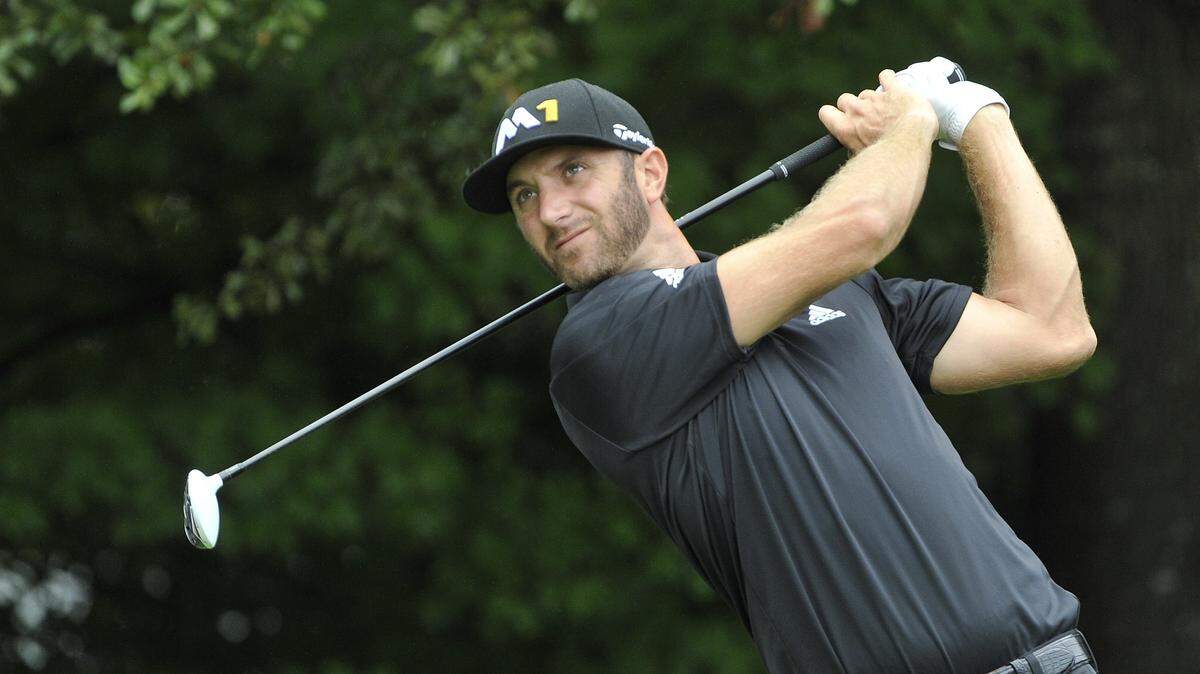Dustin Johnson tees off on the third hole during the second round of the Tour Championship golf tournament at East Lake Club Friday, Sept. 25, 2015, in Atlanta. (AP Photo/John Amis)