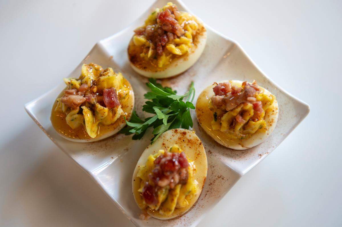 The hot honey bacon deviled eggs at the Hen House, which serves drinks and small bites, in Bay St. Louis on Wednesday, May 29, 2024.