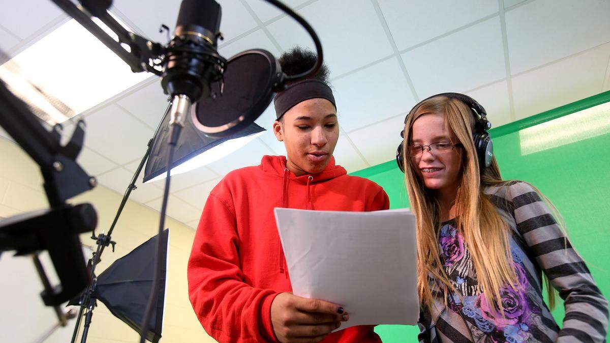 AMANDA McCOY/SUN HERALD 
 Pass Christian middle schoolers Amara Galatas, left, and Haley Clark record an audio segment while working on filming a short video project on Monday, December 7, 2015. A state report says Mississippi needs more training in film production to attract the industry.