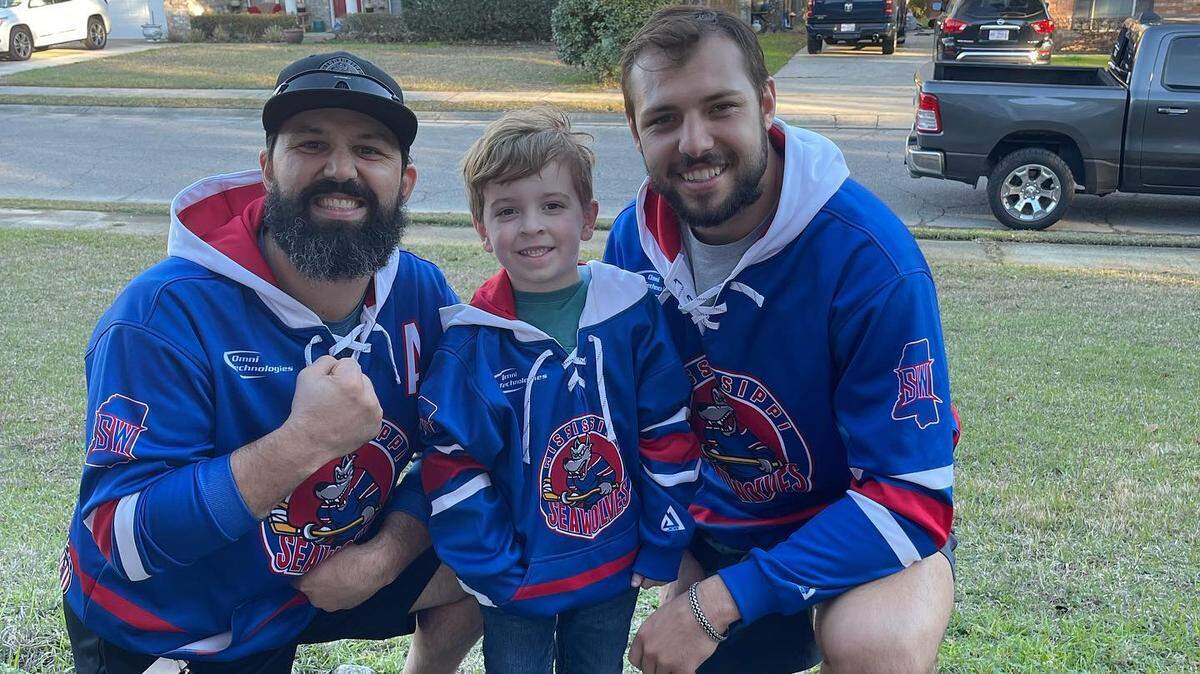 Joe Pace and Yianni Liarakos, Mississippi Sea Wolves hockey players, visit Cooper Diaz after the Biloxi child was hit in the head with a hockey puck during a game.