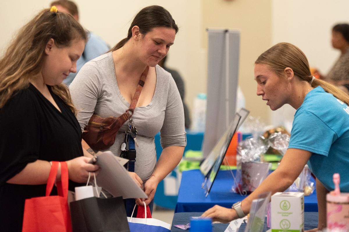Expecting families meet with vendors during a community baby shower event at Lyman Community Center in Gulfport on Thursday, Nov. 14, 2024.