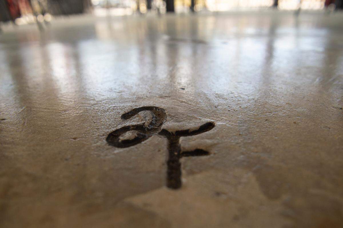 The cattle brand logo for the Fergusons’ cattle company, Double F Cattle Company, is embedded in the floor of the Fergusons’ new diner, Luckies Diner, in Vancleave on Monday, March 10, 2025.