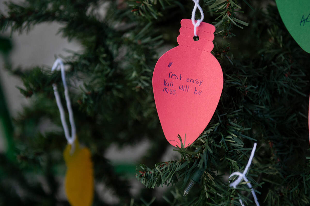 A note placed on on a Christmas tree during a candlelight vigil in honor of three Gautier High School graduates, Se’Dhari Saniya Watson-Person, Kyla “Muffin” Watkins, and Tatyanna Richmond, at Gautier High School in Gautier on Thursday, Dec. 7, 2023. The tree will be placed inside Gautier High School in memory of Watson-Person and Watkins, who were killed in the crash.