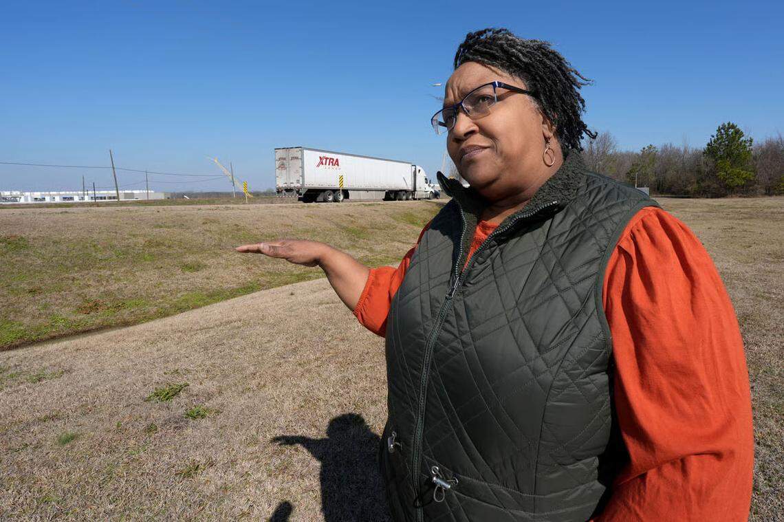 Canton Alderwoman Cynthia Allen gestures toward Amazon’s partially completed data center campus across from her home in Canton. Like many of her neighbors, Allen says her quality of life has suffered since Amazon began building the facility.