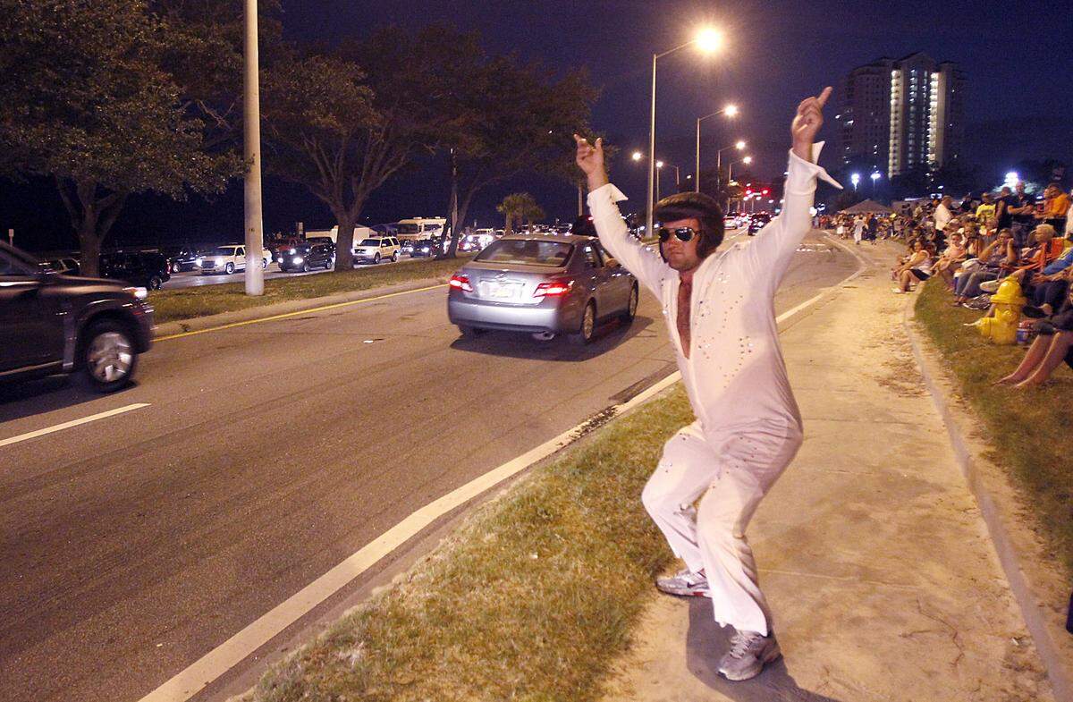 Darren Babin channels Elvis as he performs for the cruisers Saturday night along Beach Boulevard in Biloxi during Cruisin’ The Coast.