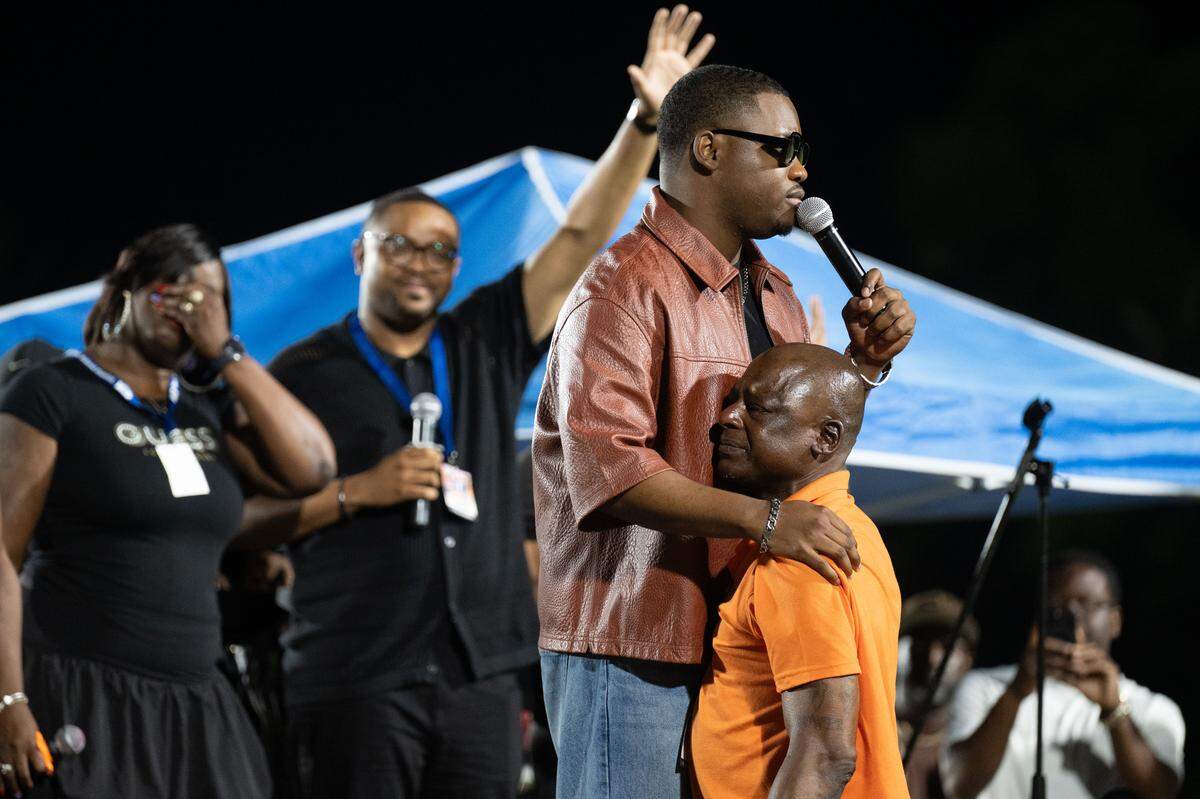 Daniel Stallworth holds his brother Gary during Tuesday’s show.