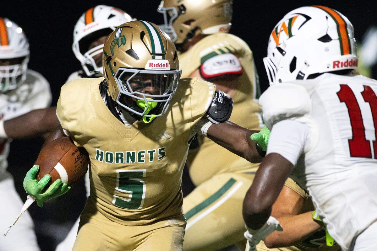 Poplarville’s Tylan Keys (5) looks for room to run Friday in the Hornets’ loss to West Harrison.