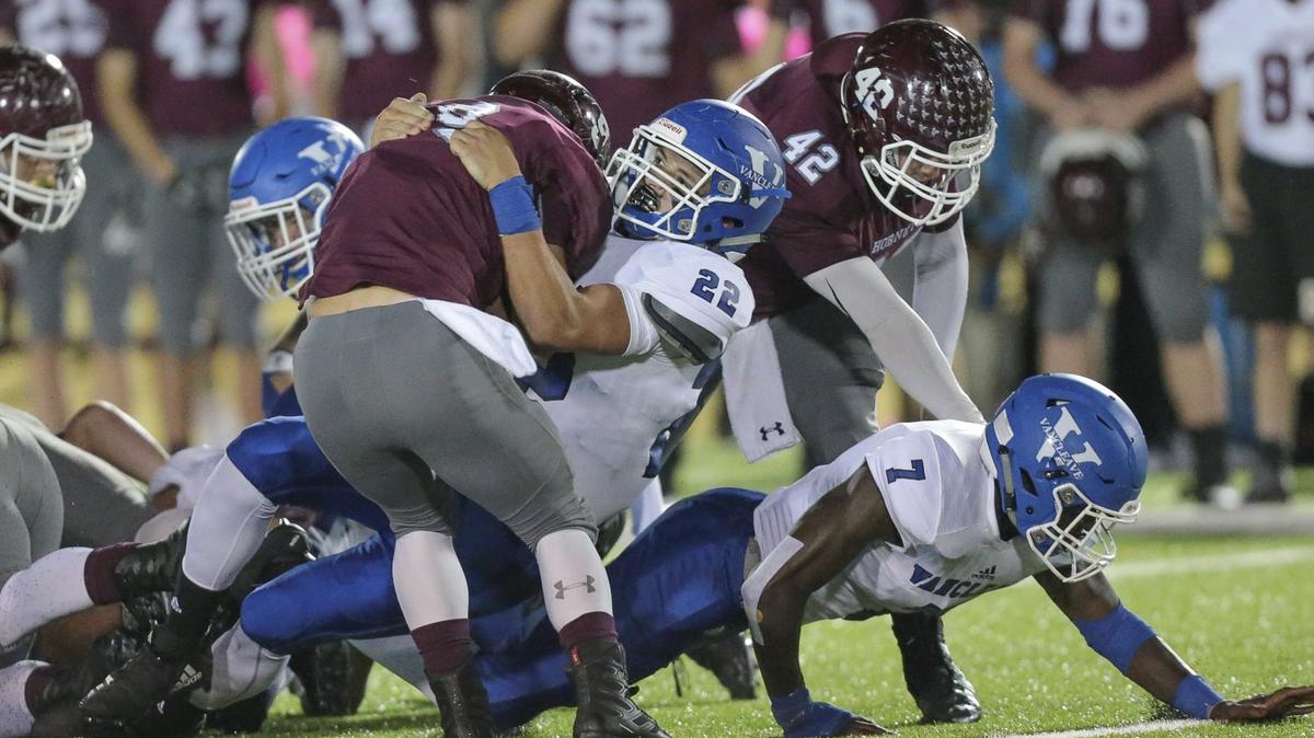 Vancleave Cody Bean (22) tackles East Central running back Dylan Grinsteinner (9) at the line of scrimmage during the game between Vancleave and East Central at East Central, Friday, October 26, 2018.