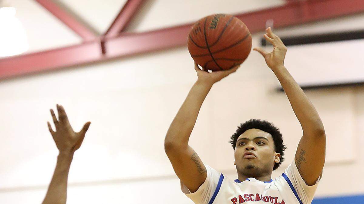AMANDA McCOY/SUN HERALD 
 Pascagoula's Jacques Belford takes a shot while competing against West Harrison on Tuesday, January 12, 2016, at Pascagoula High. Pascagoula defeated West Harrison, 50-48.