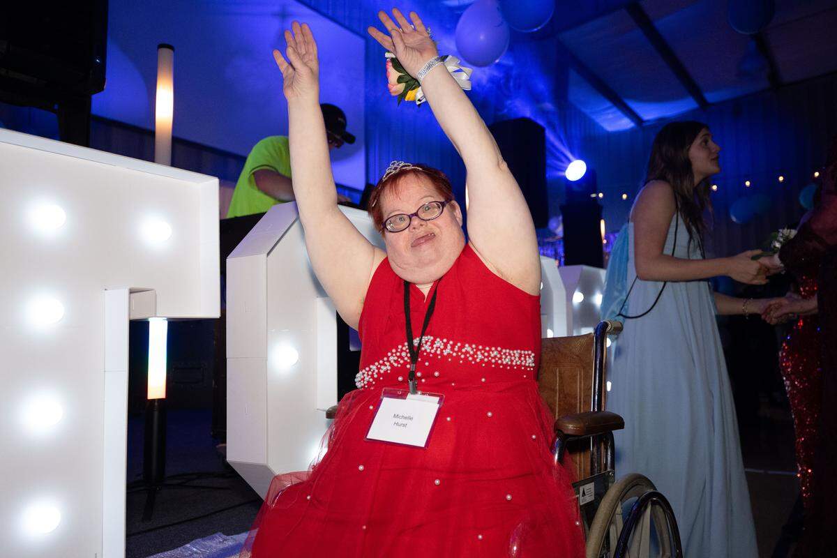 Michelle Hurst dances in her wheelchair during Night to Shine at Woolmarket Baptist Church on Friday, Feb. 13, 2026.